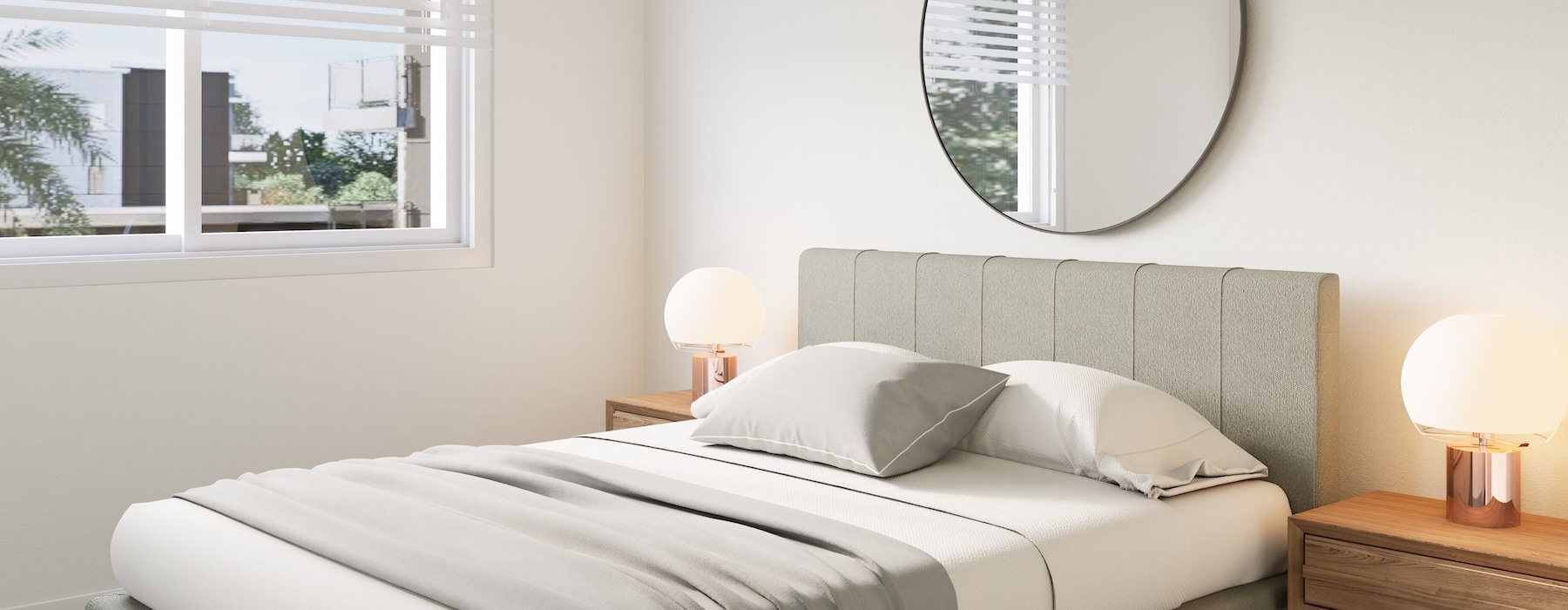 a bed with a mirror above it