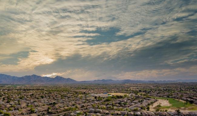 a landscape with mountains in the background